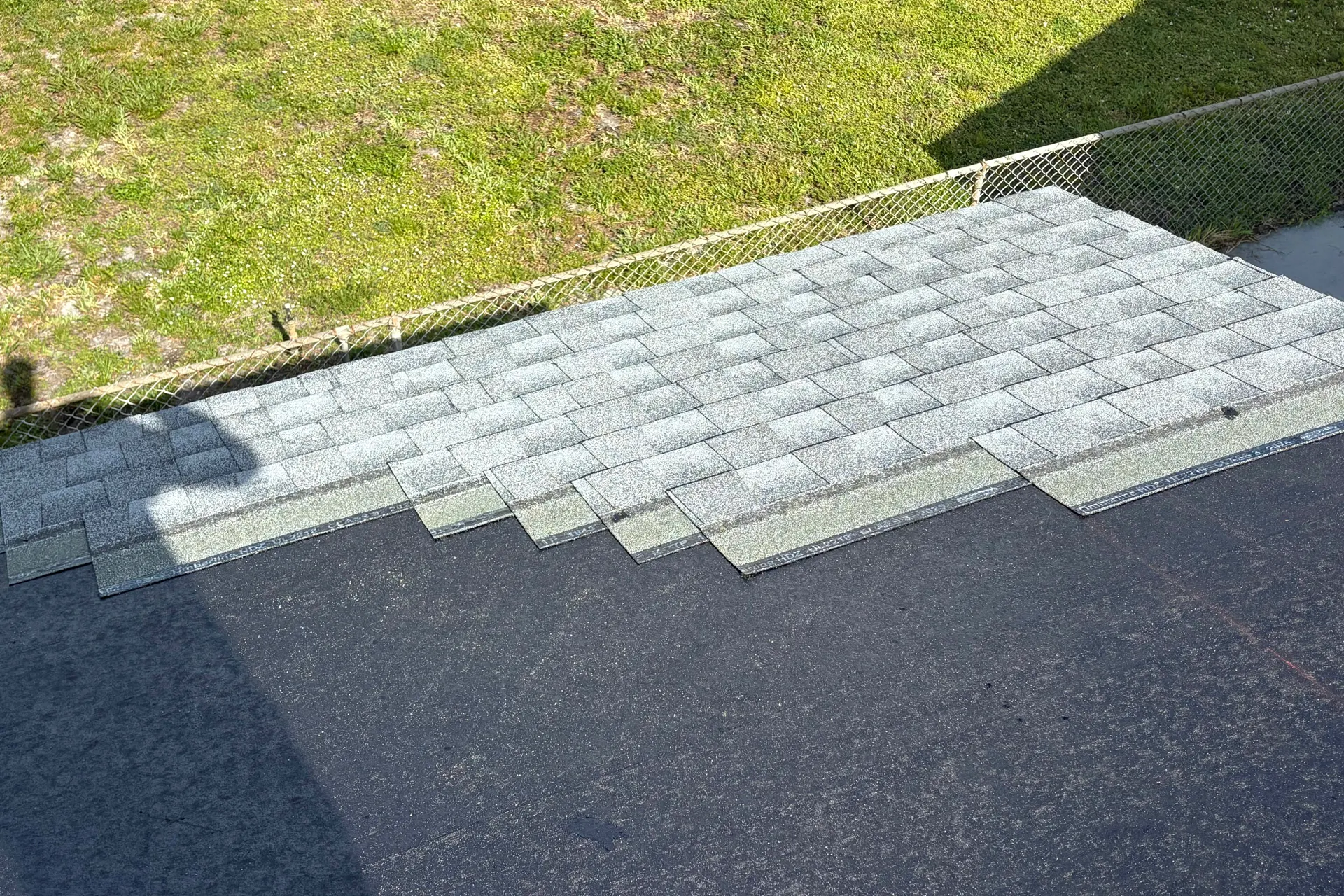 Roof repair work in progress on a residential roof